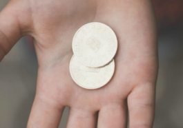 money in hand of child