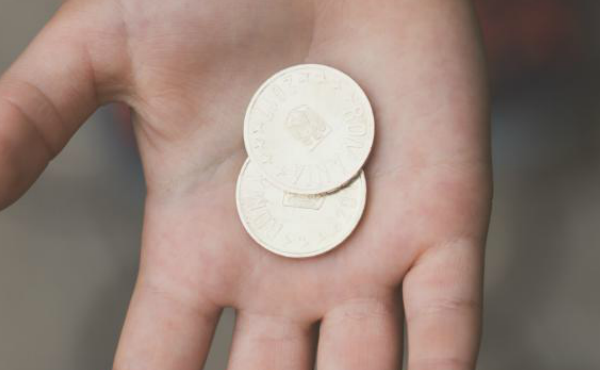 money in hand of child