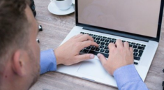 man on laptop making money writing online