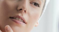 woman using cream to slow down the aging process