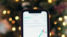 mobile phone being used for investing money for profits